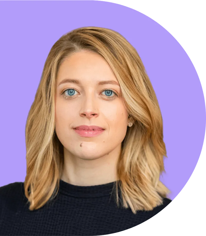 A woman with blonde hair and blue eyes.