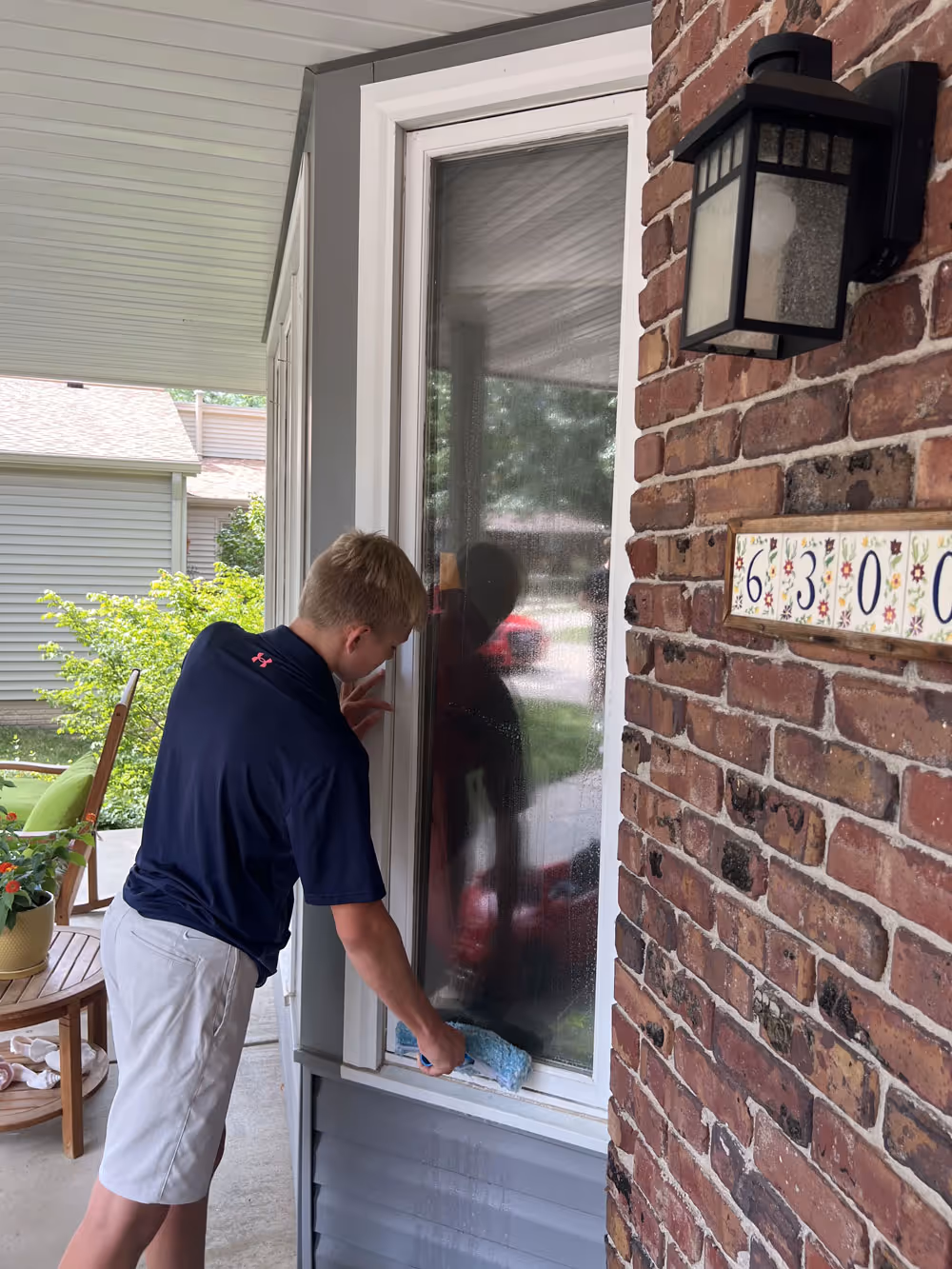 Traditional window cleaning in progress.