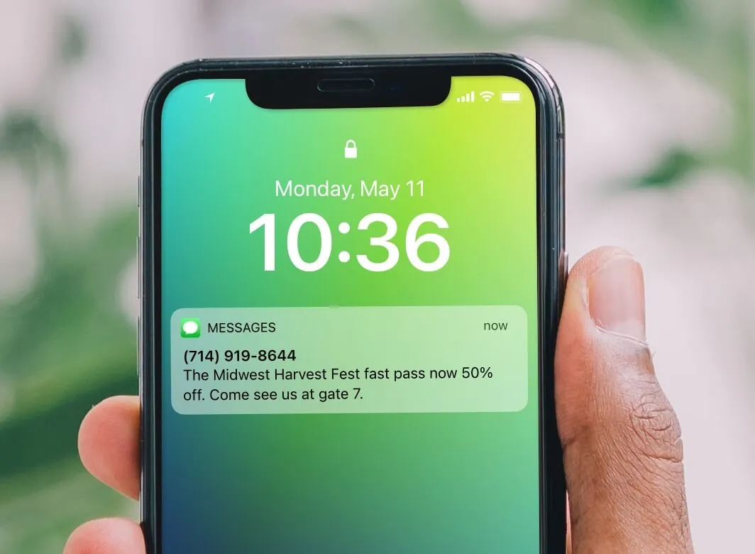 a hand holding a phone