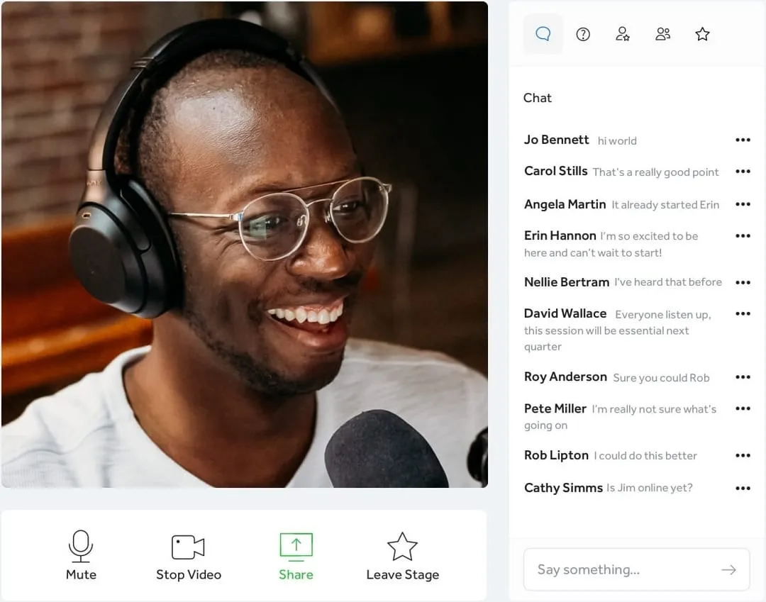 a man wearing headphones and smiling