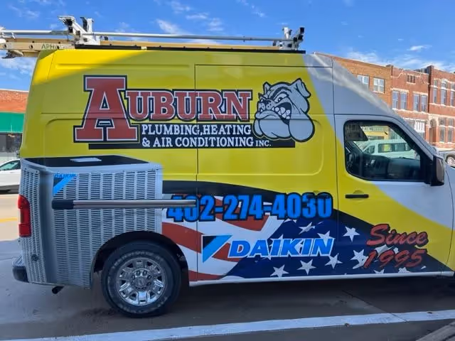 Auburn Plumbing & Heating service van with Daikin branding.