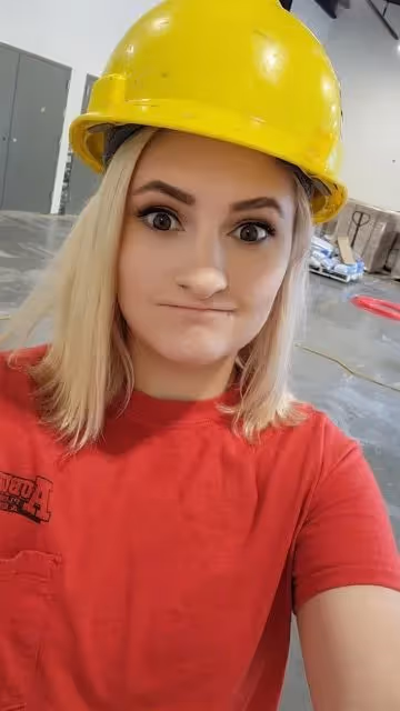 Selfie of an Aslan Mechanical team member wearing a red shirt.