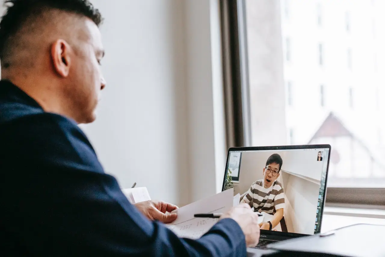 a man in front of a laptop