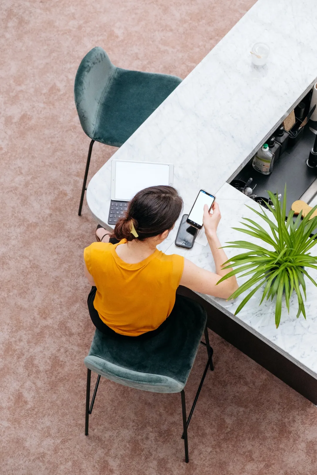 sitting woman checking a smartphone