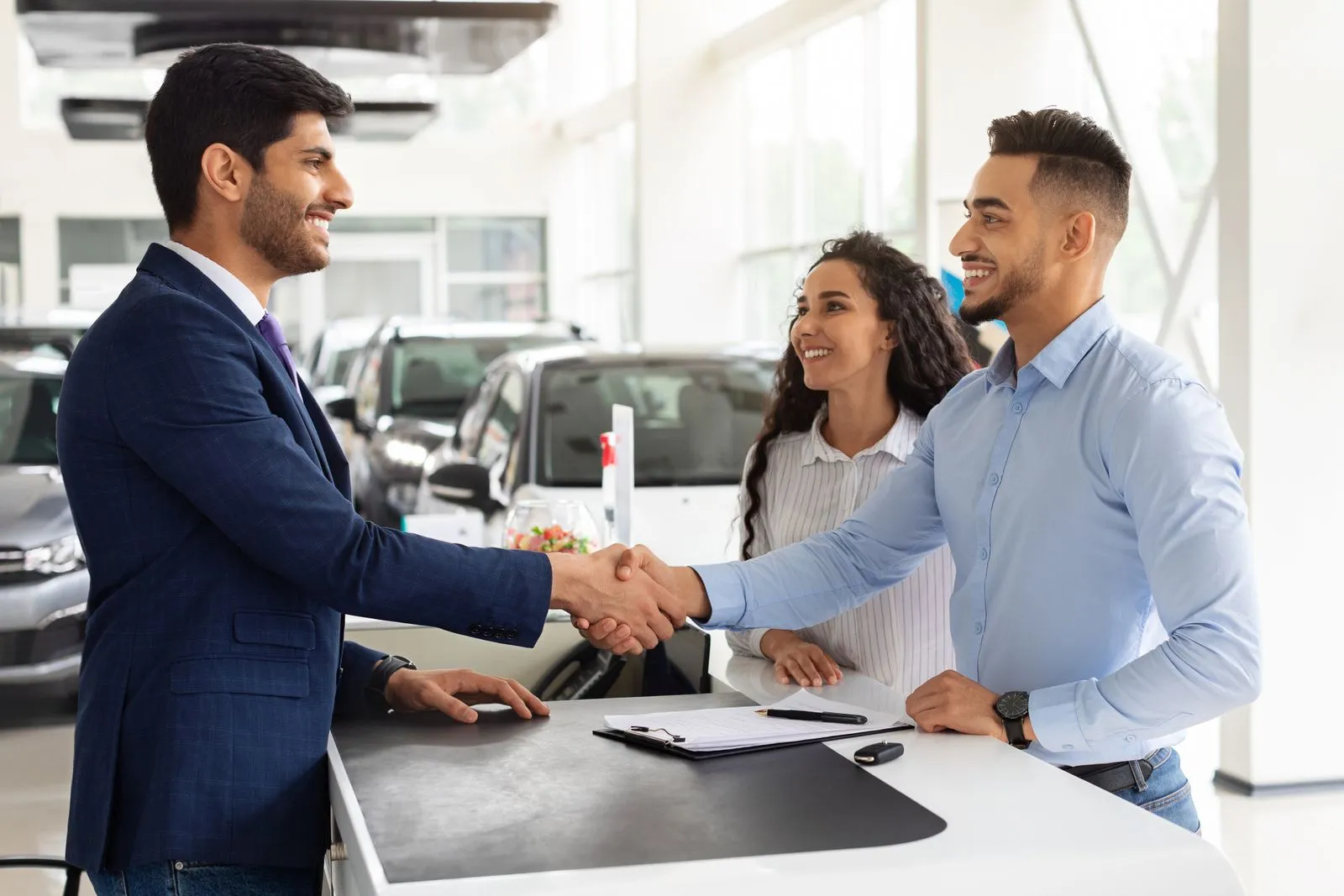 Salesperson and a client coming to an agreement and shaking hands