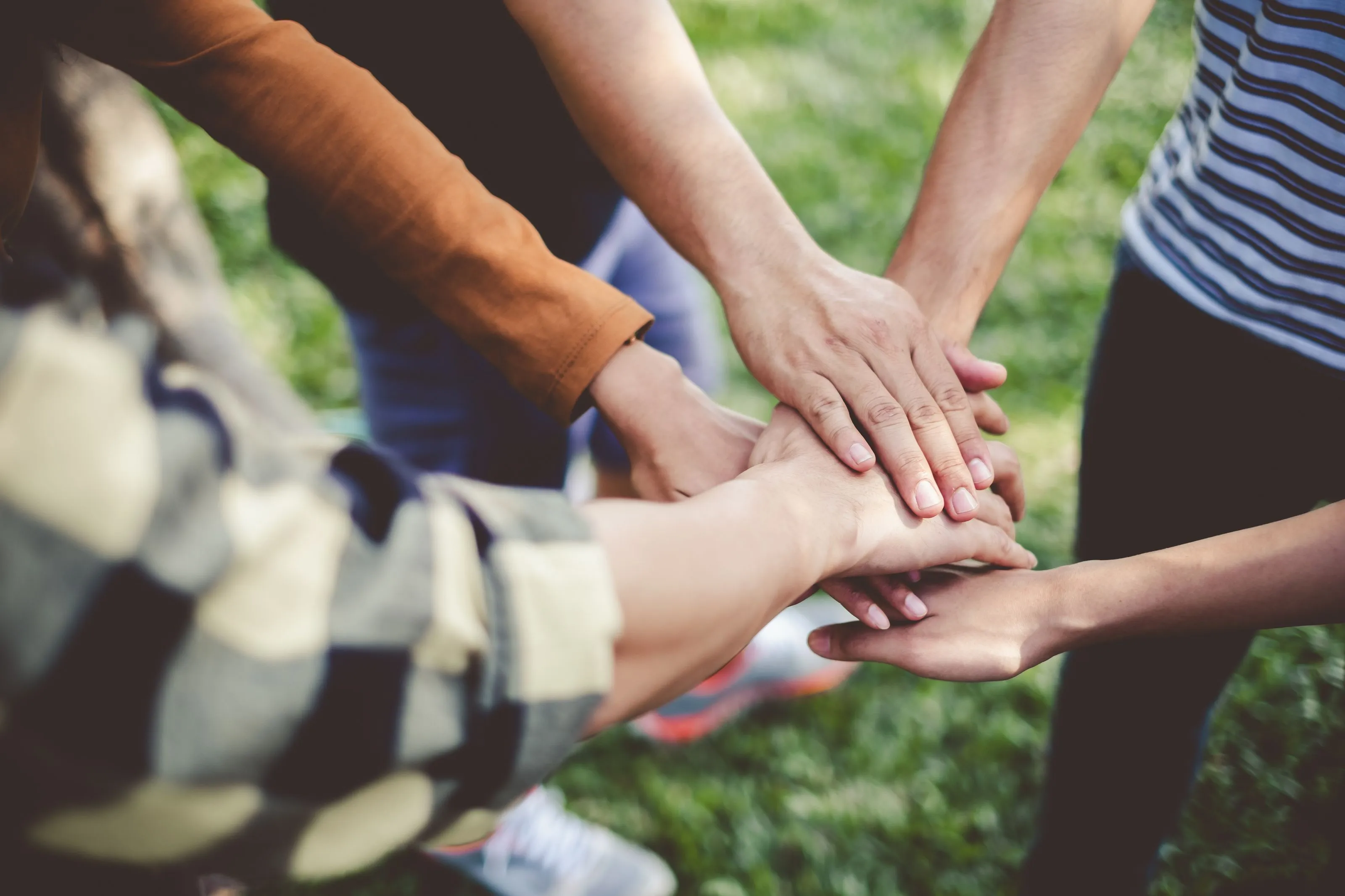 People holding hands in a group