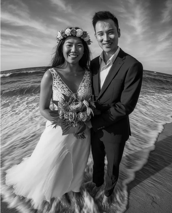 A newly wed on the beach, black and white style.