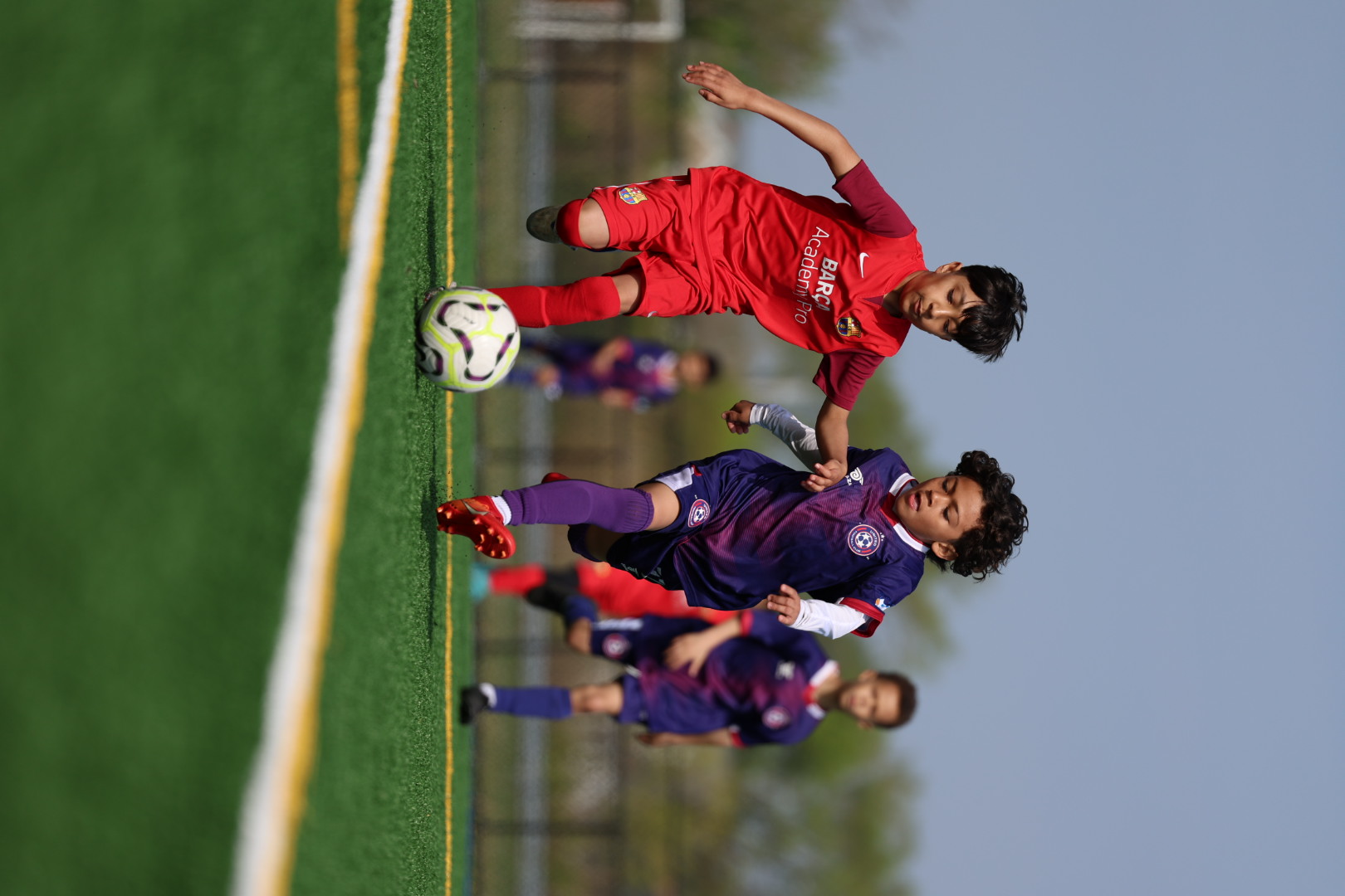 image of students working on a collaborative project in an open courtyard
