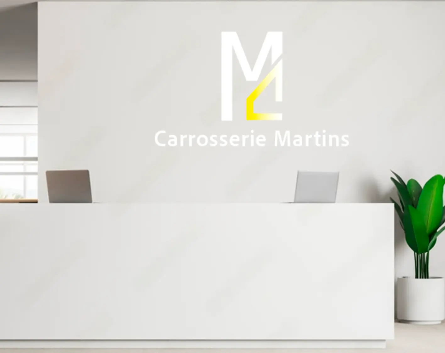 White reception desk with two laptops, a green potted plant on the right, and a Carrosserie Martins logo on the wall behind.