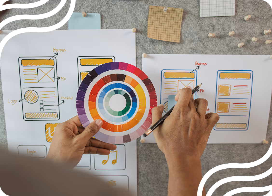 Web designer working on a wireframe with a color palette