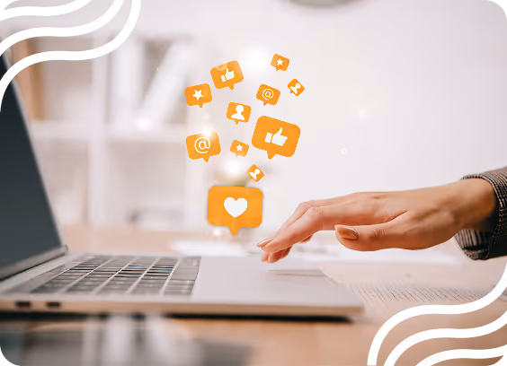 hand over a keyboard with social media icons floating in the air