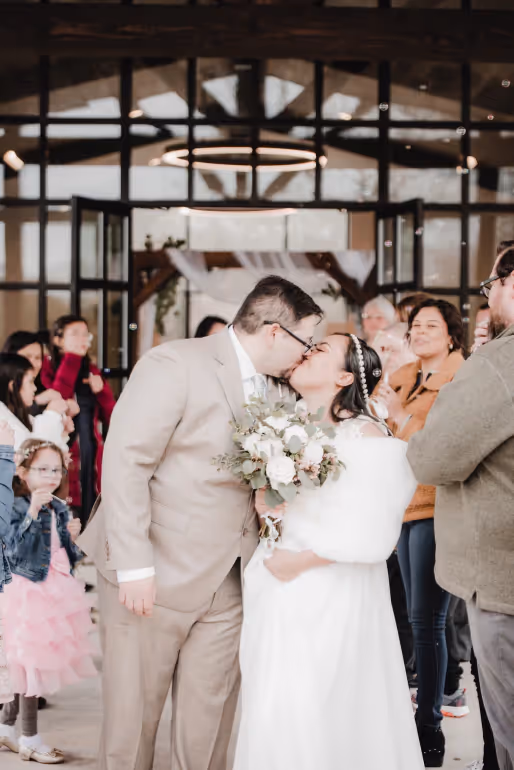 Bride and groom kissing at a wedding