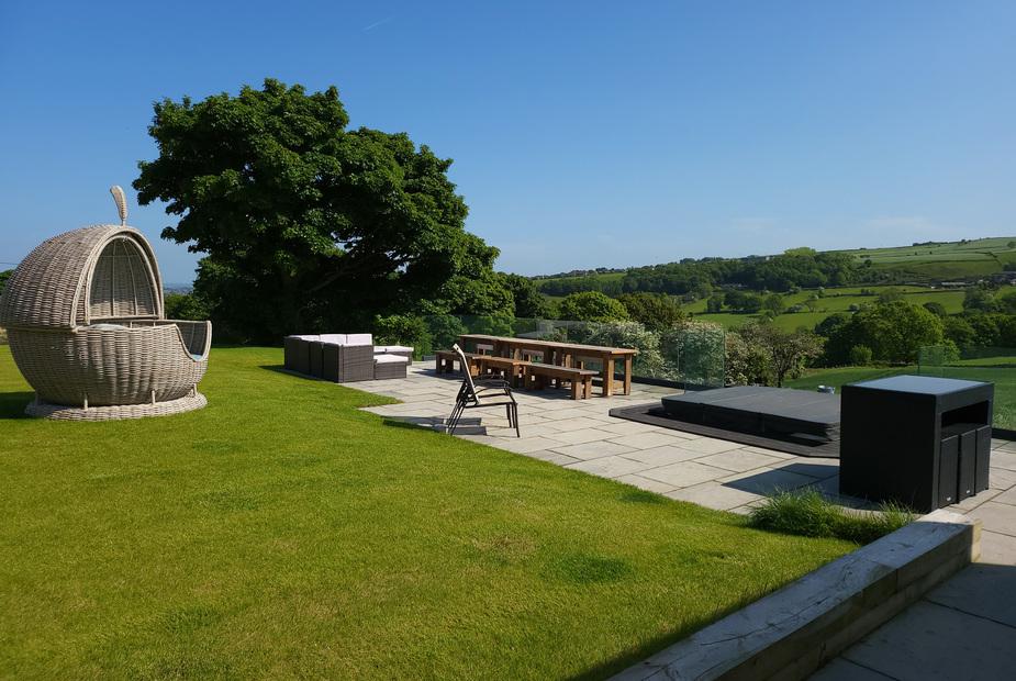 Cottage patio with outdoor seating, hot tub and countryside views
