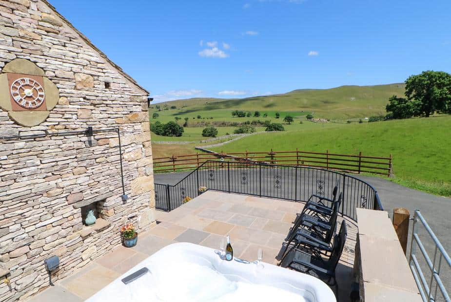 Cottage patio with hot tub and countryside views