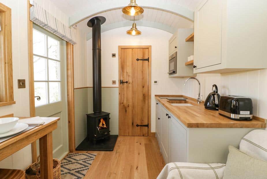 Cottage kitchen with wood burner and wooden worktops