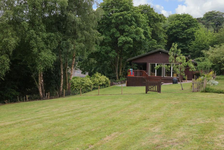 Kipling Lodge with large garden and woodland backdrop