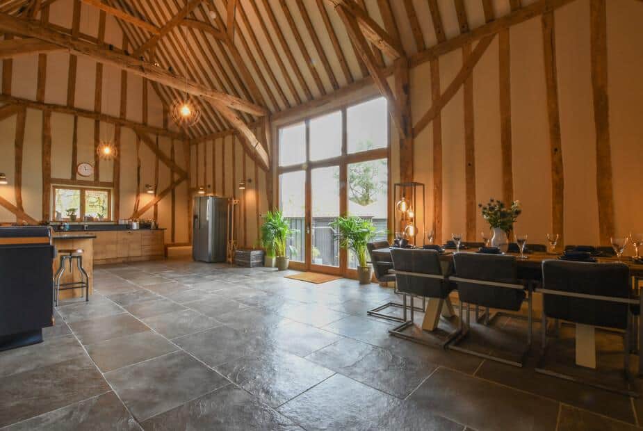Cottage kitchen diner with exposed beams and large windows