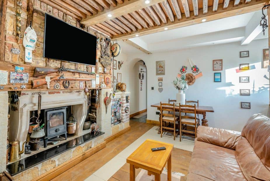 Living room with wood burner and dining table