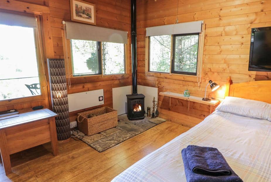 Bedroom with wood-burning stove and single bed