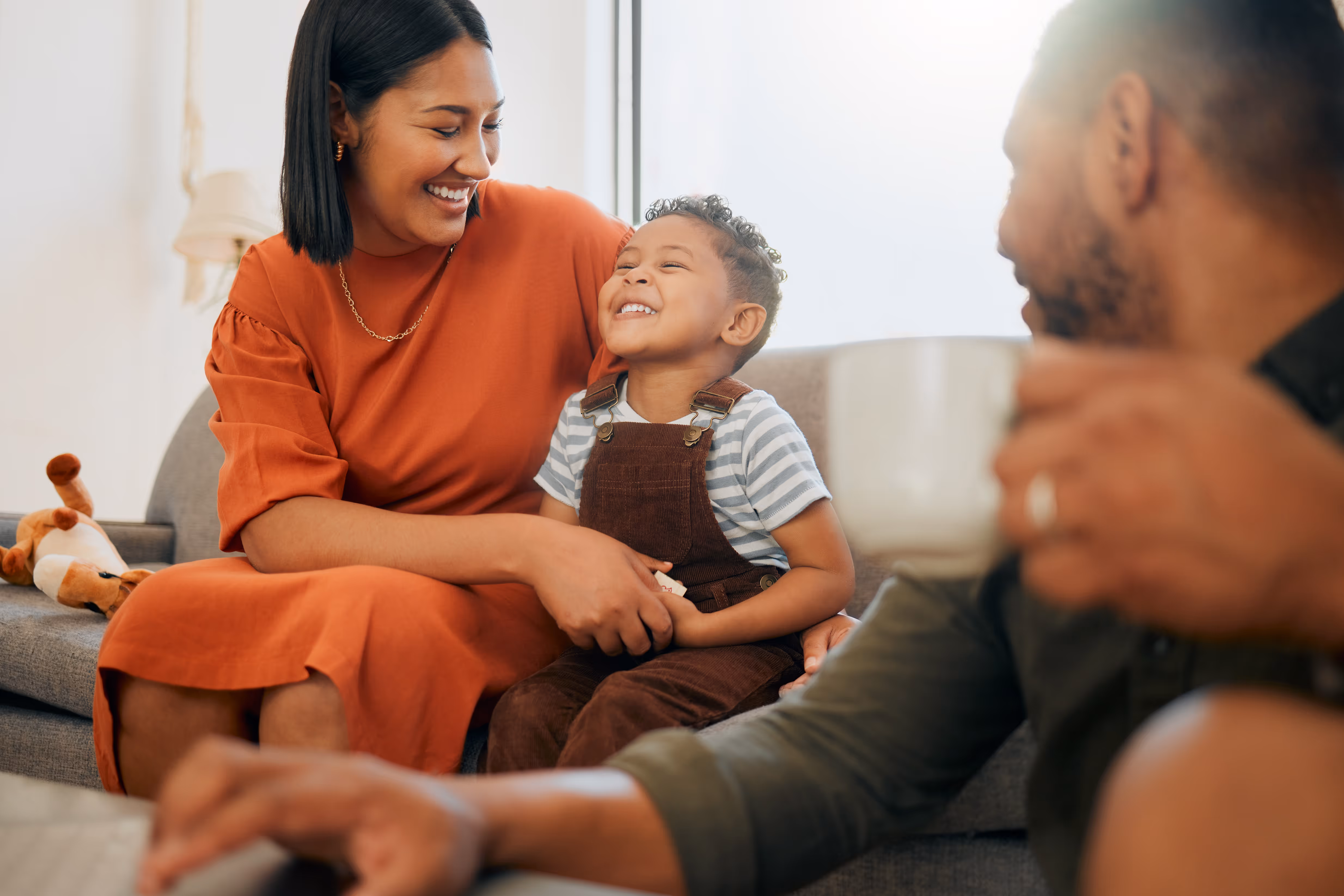 Woman smiling with young boy stock photo
