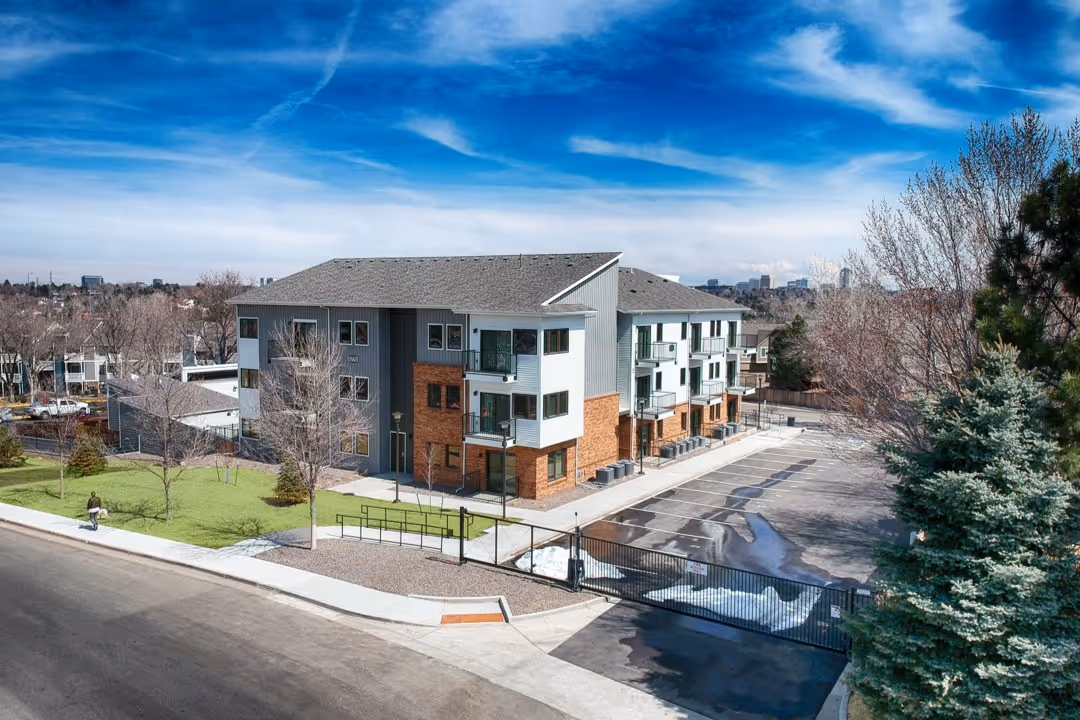 Aerial view of the modern apartment building and surrounding grounds at Villas at Holly in Centennial, CO, showing the new construction.
