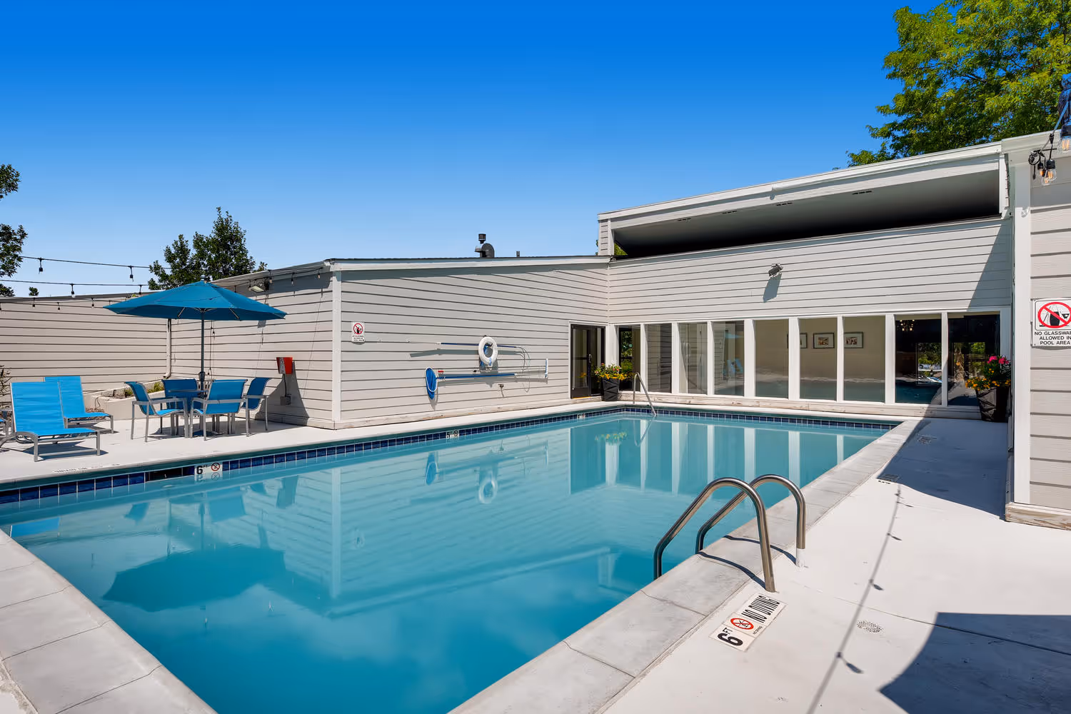 Sparkling swimming pool set on a sunny day at Villas at Holly in Centennial, CO.