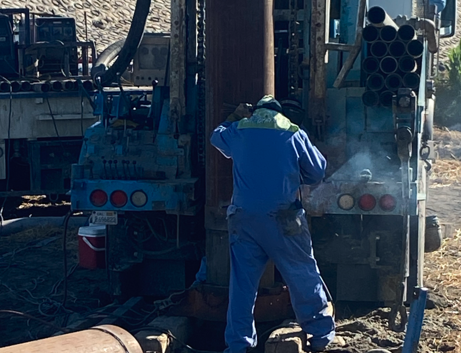 Drilling crew weld casing during the installation process.