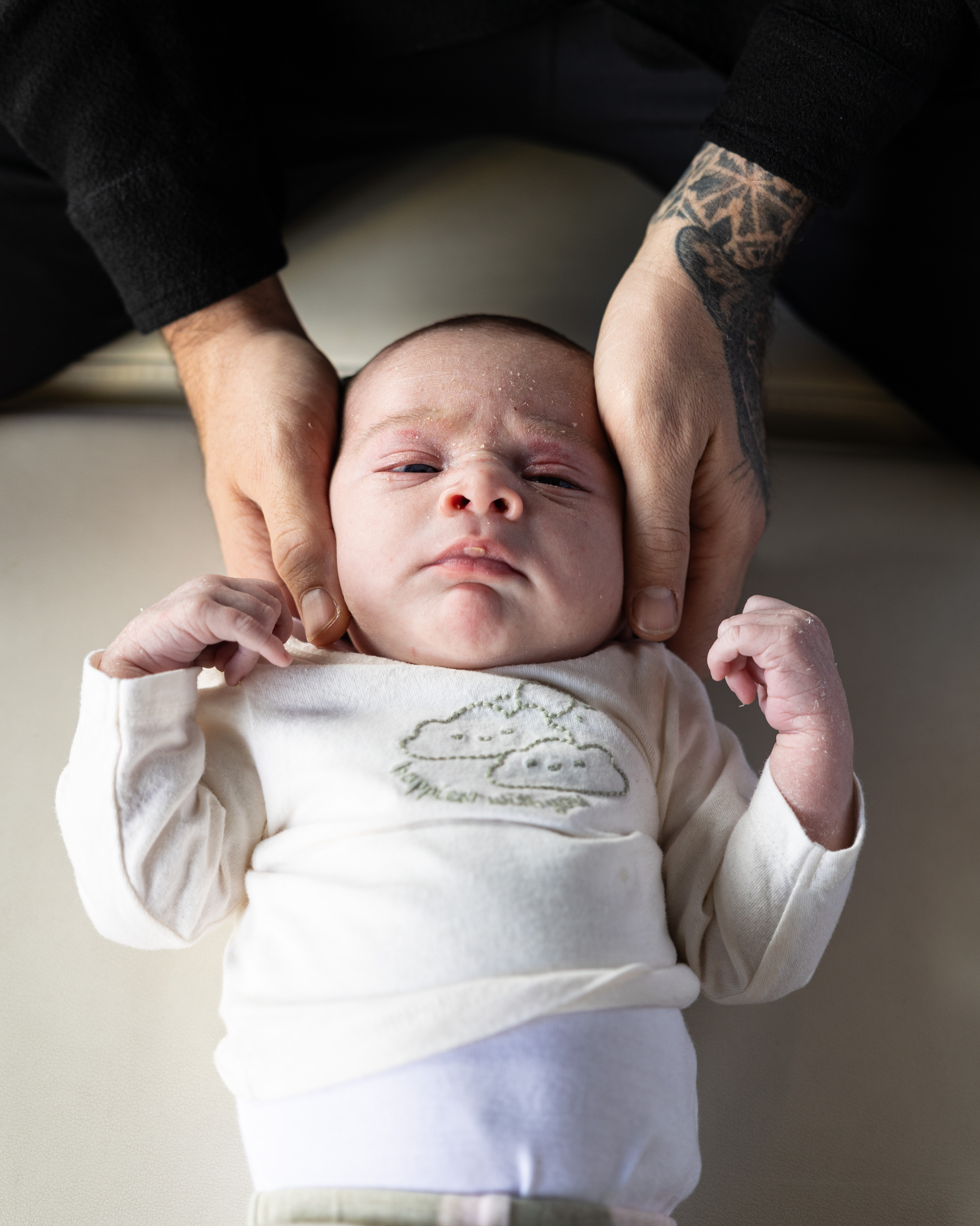 Chiropractor adjusting a child's spine