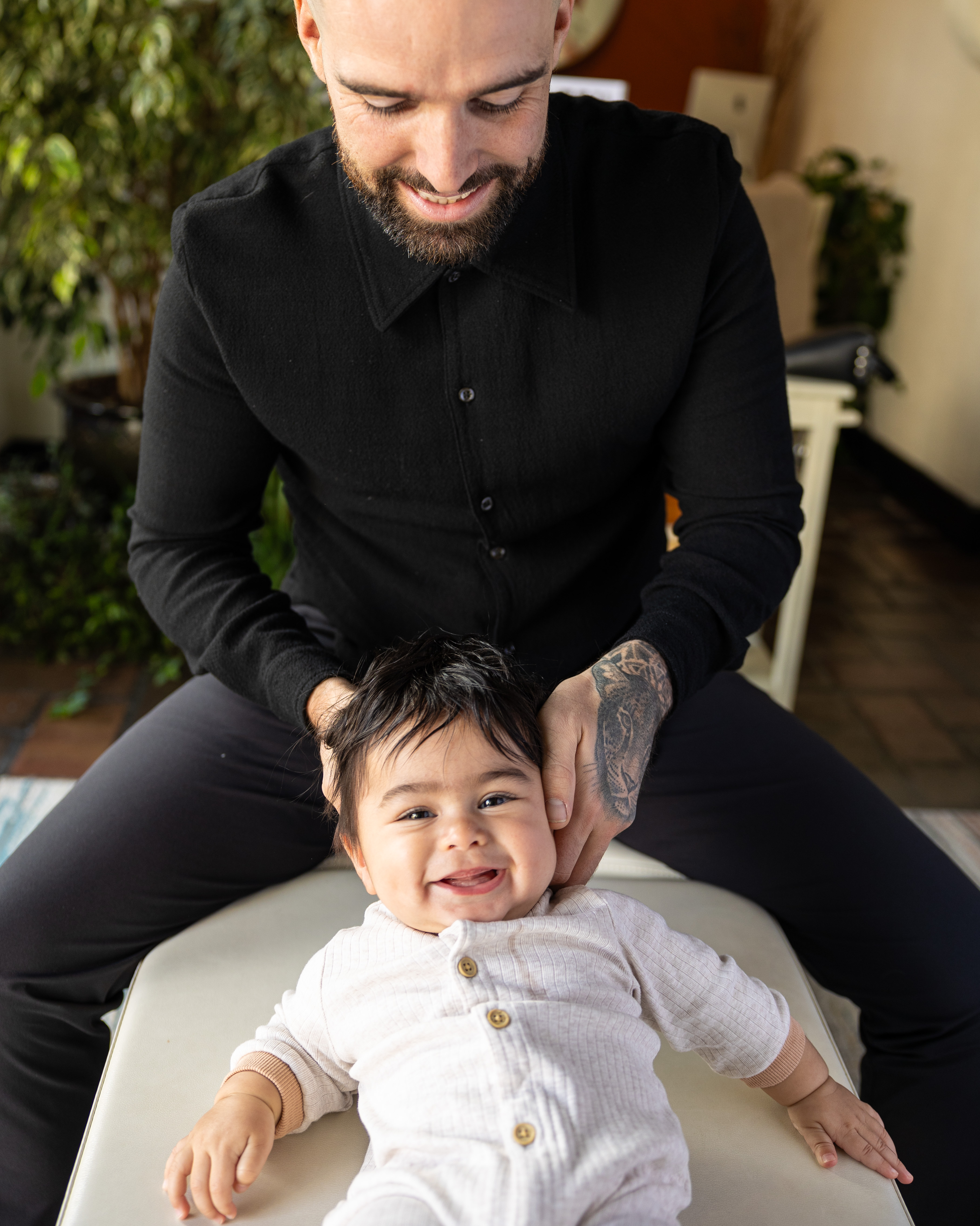 Chiropractor adjusting a child's spine