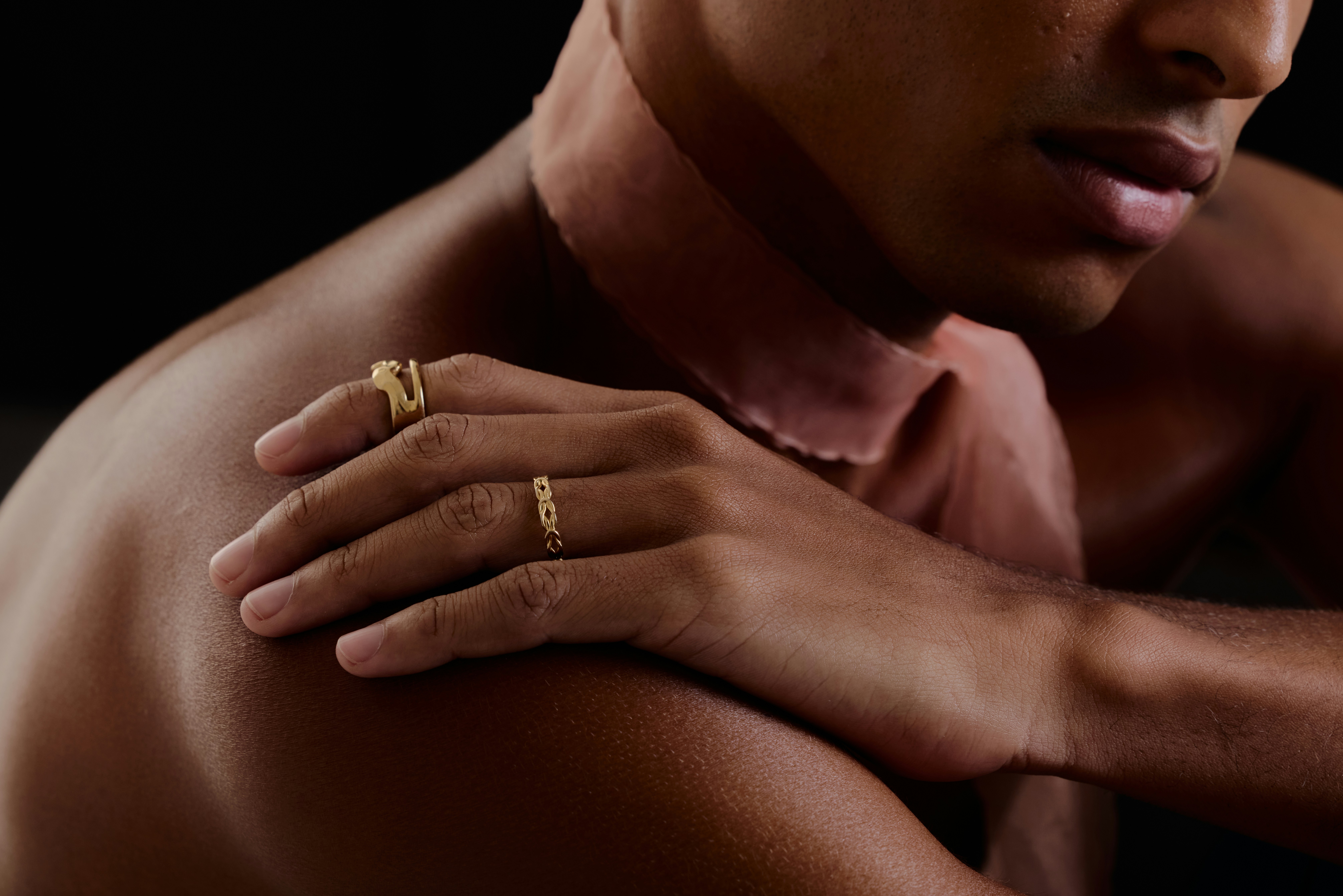 woman in black brassiere and white pants lying on bedby Daniel Koponyas