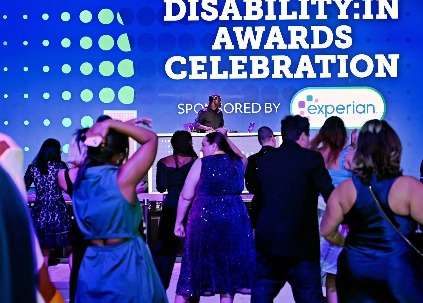Disability Awards Celebration at the Disability:IN 2025 Conference. Attendees are dancing on the dance floor with a DJ in the background.