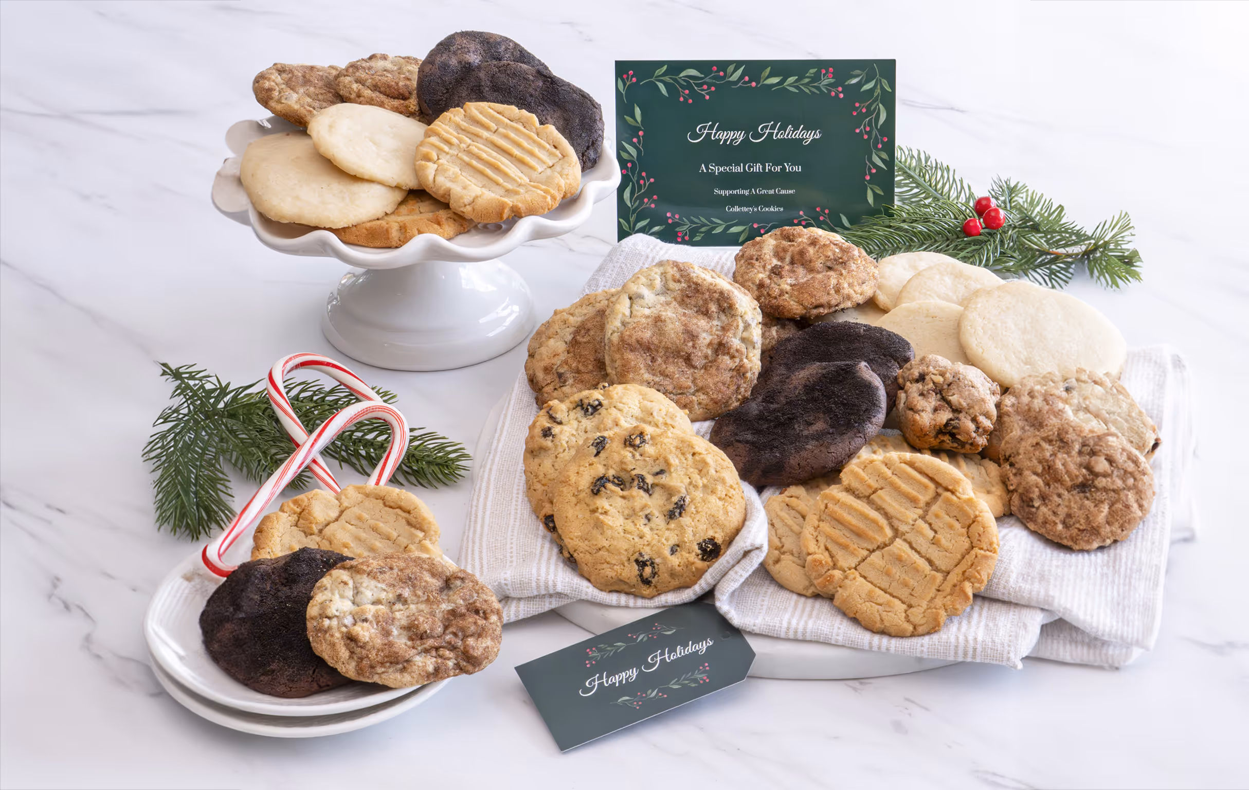 Holiday-themed spread of cookies with Happy Holidays cards.