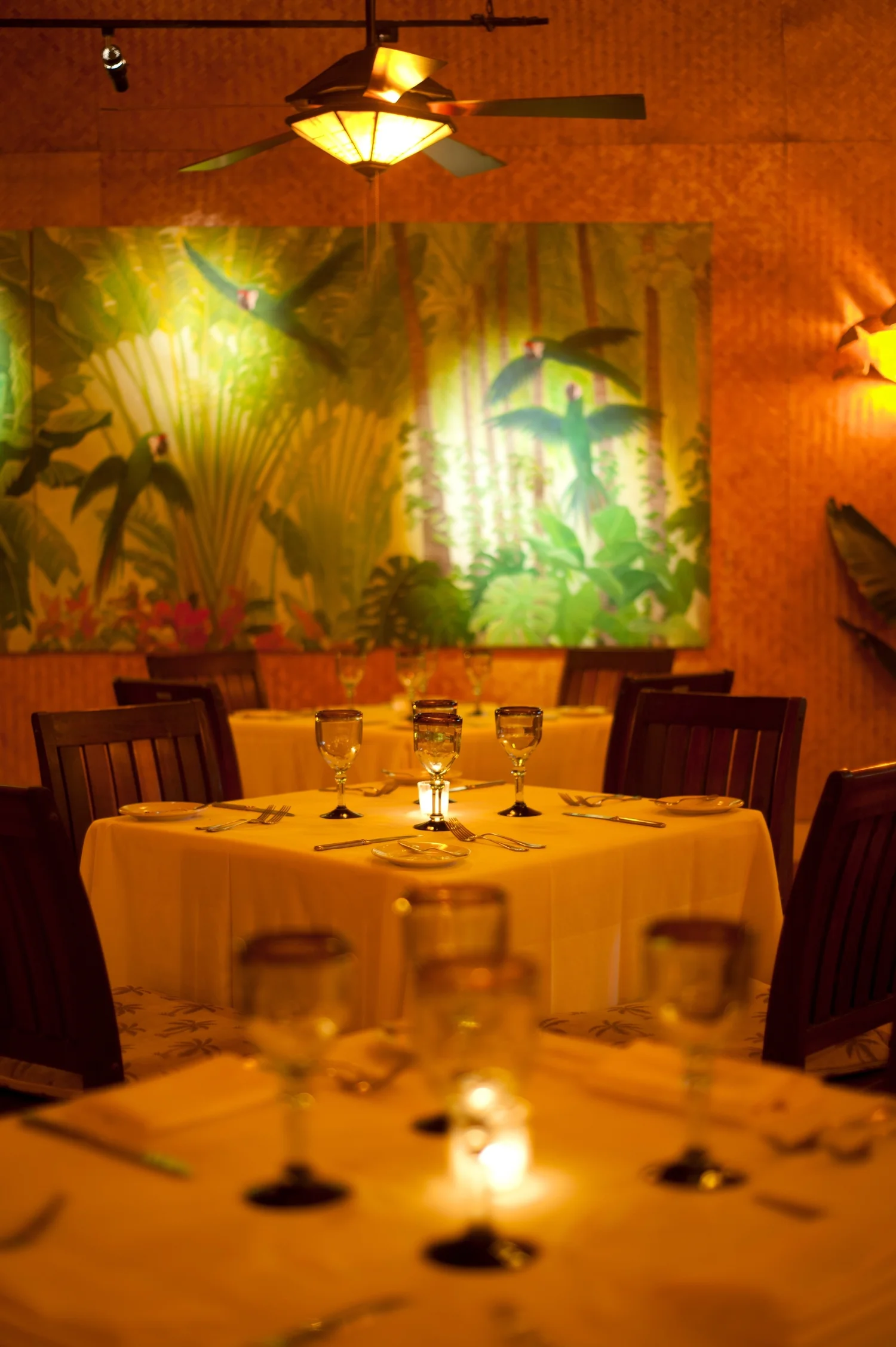 A candlelit table for two in La Palapa’s dining room