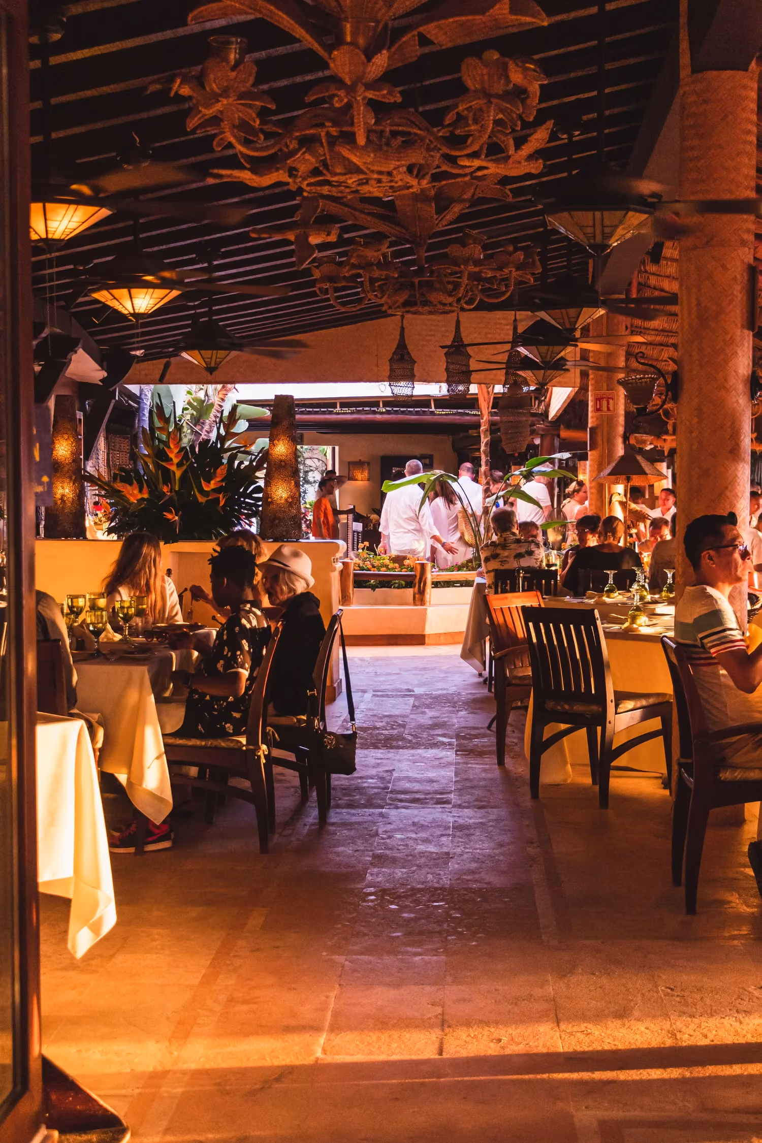 La Palapa staff working the dining room under the palapa roof