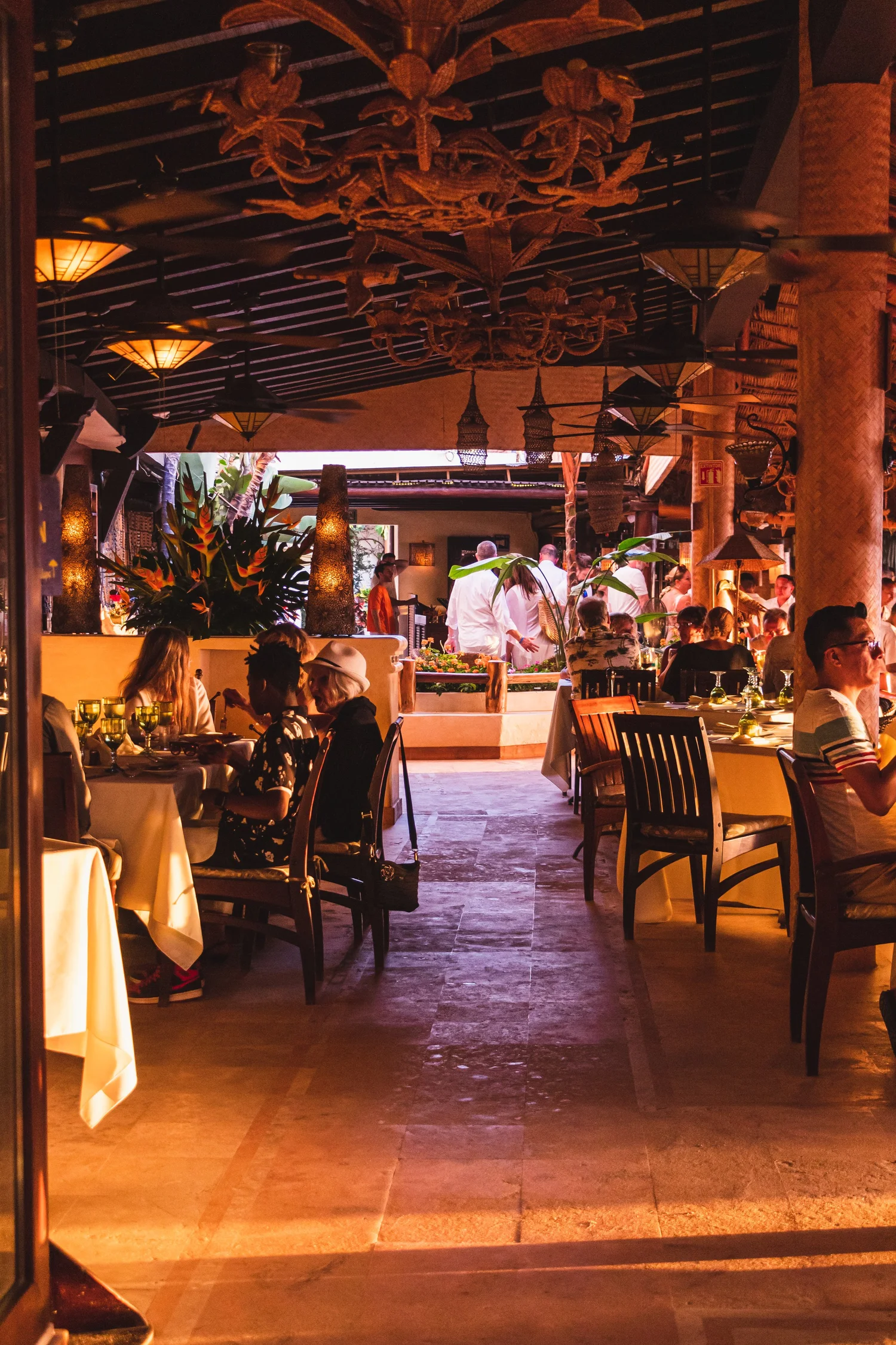 La Palapa staff working the dining room under the palapa roof
