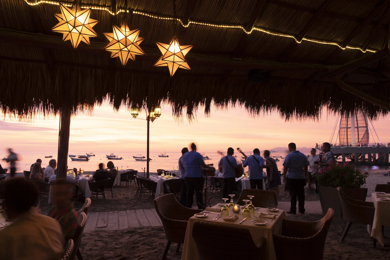 Sunset over the oceanfront dining terrace at La Palapa, Puerto Vallarta
