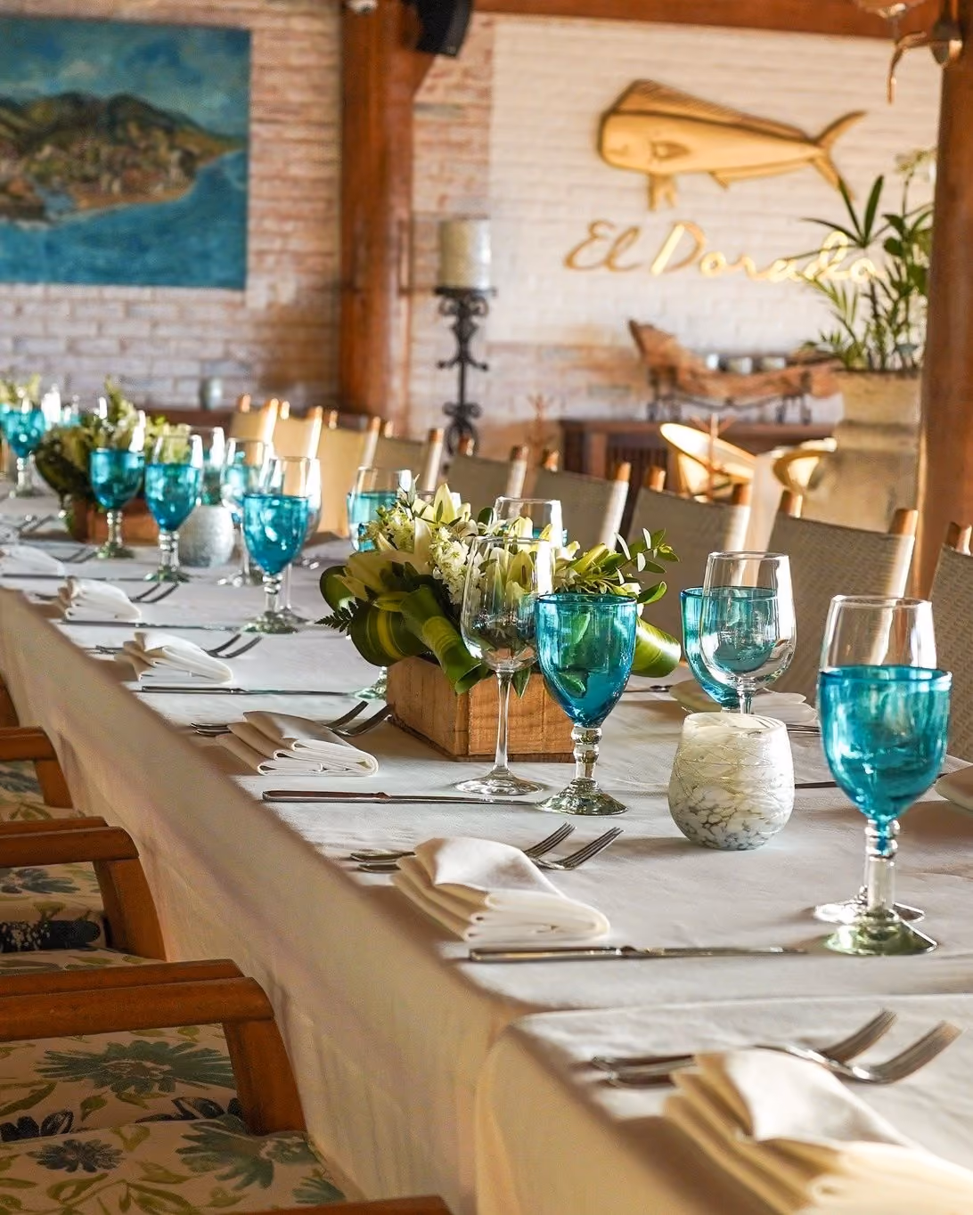 Long table set with turquoise glasses at El Dorado