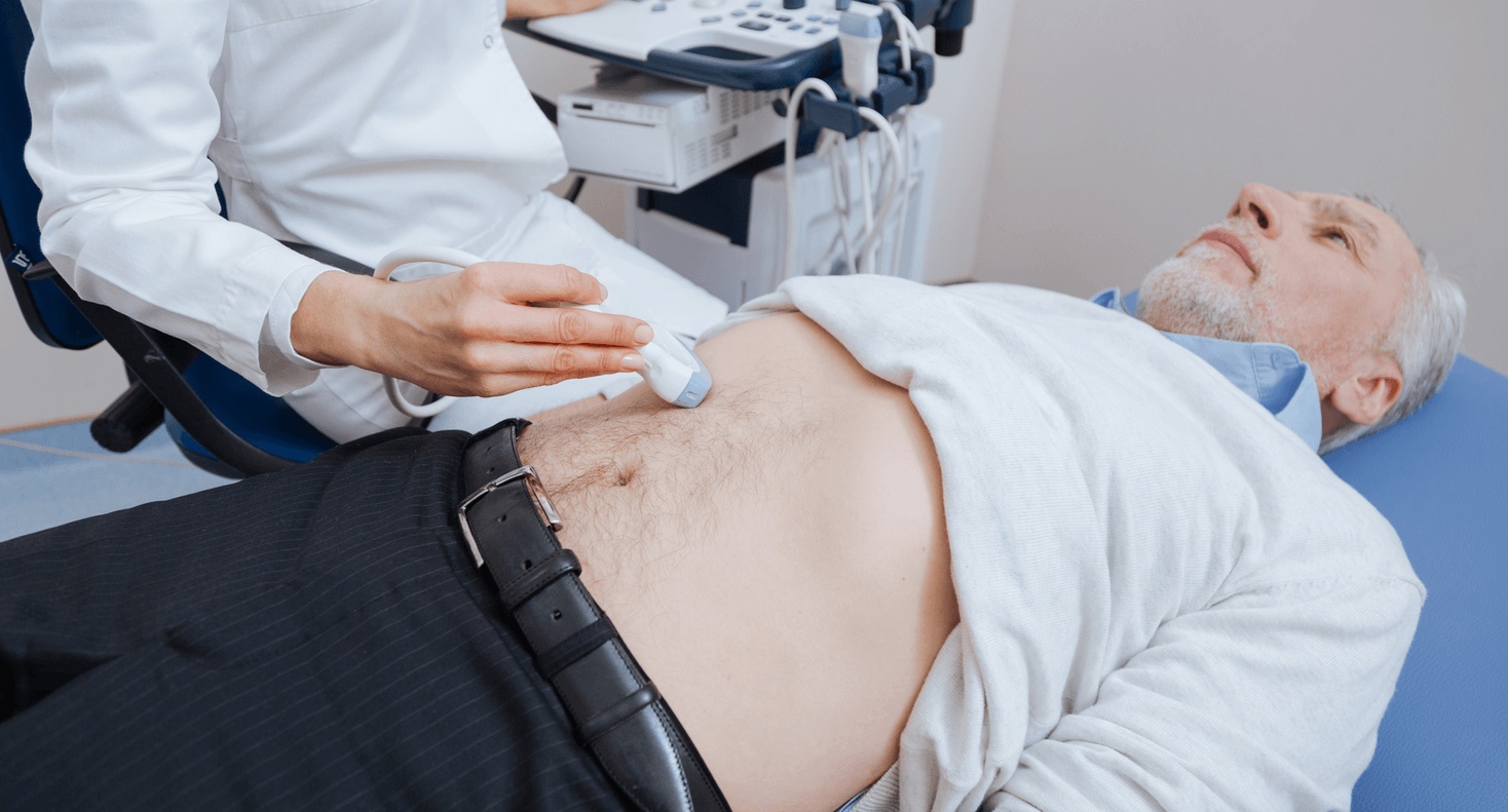 Doctor performing abdominal exam with ultrasound on patient while diagnosing acid reflux with the best GERD specialist in Los Angeles.
