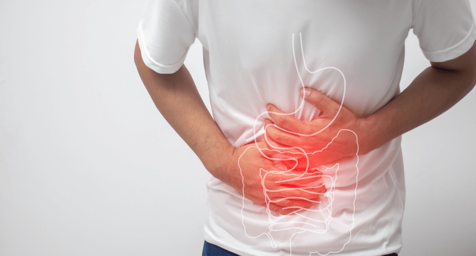 Person experiencing abdominal pain with highlighted digestive system illustration, seeking diagnosis and care from the best gastroenterologist in Los Angeles.
