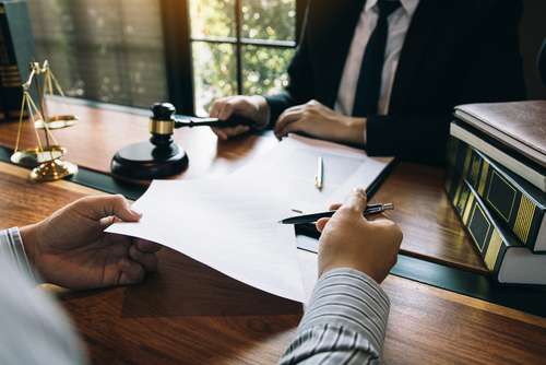 Man holding pen and paper