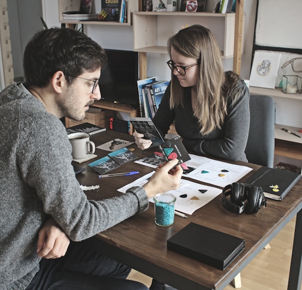 man and woman sitting at table