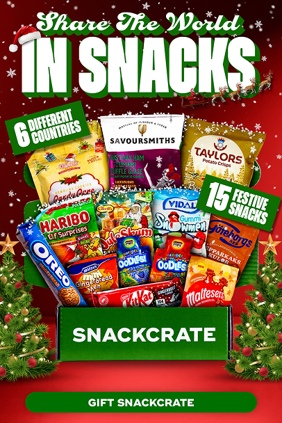 Festive SnackCrate gift box filled with assorted snacks from six countries, featuring holiday-themed packaging and a red background with snowflakes and Christmas trees.