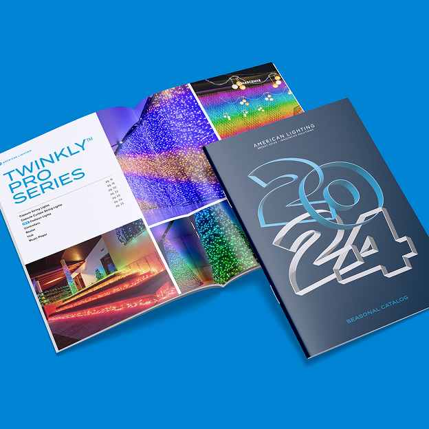 Open and closed 2024 American Lighting seasonal catalogs featuring colorful decorative lighting displays.