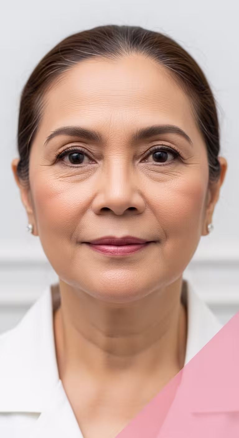 Woman in a white top facing the camera, chin and jawline in view