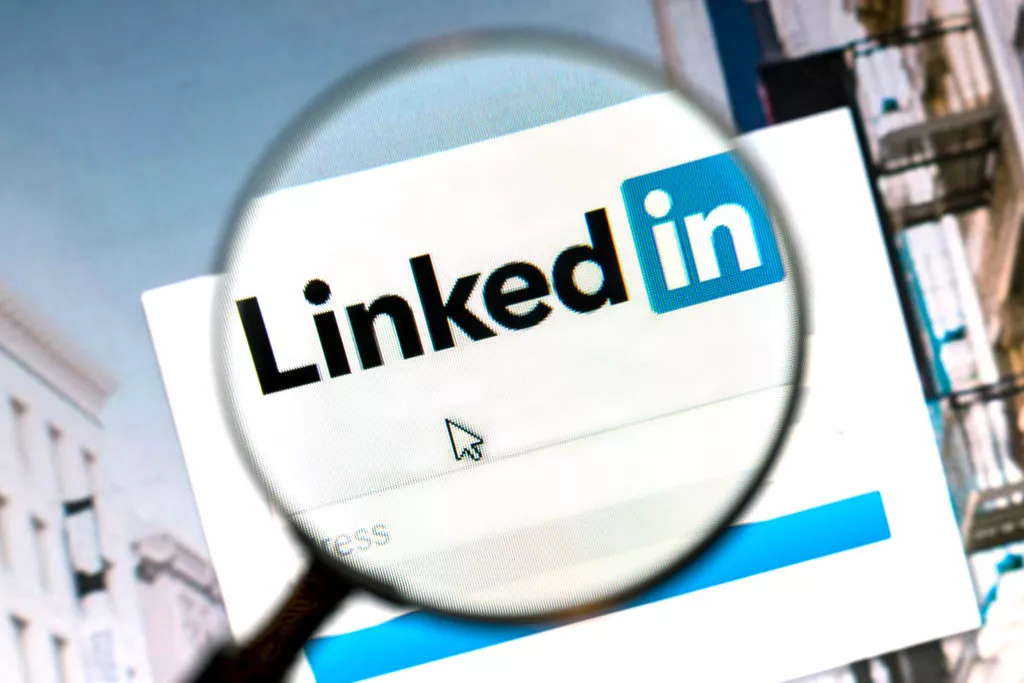 Linkedin website under a magnifying glass. Linkedin is a business oriented social networking website.