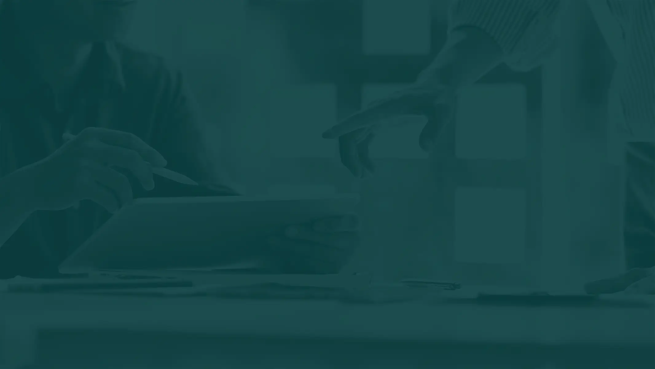 A group of people sitting around a table.