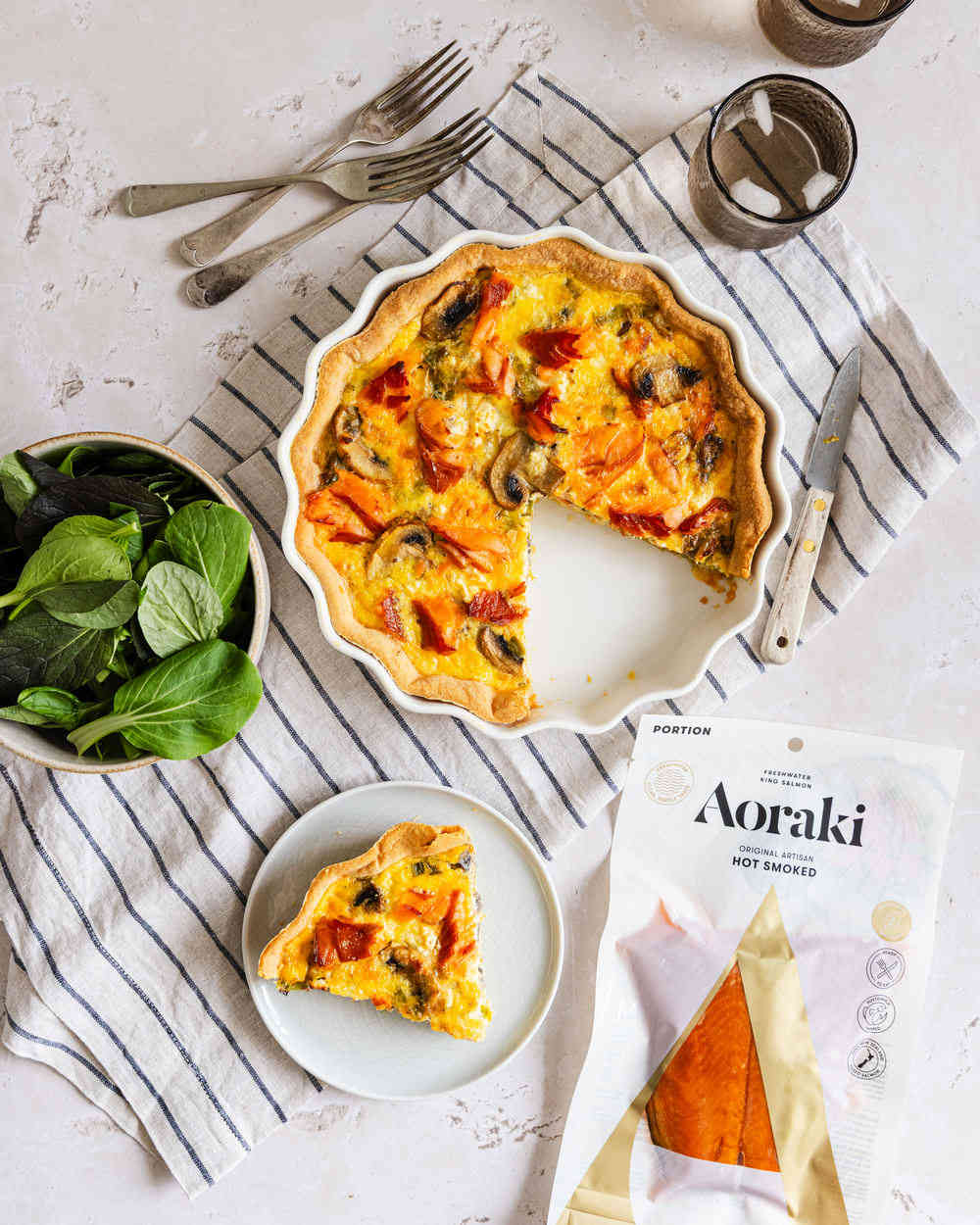 Aoraki smoked salmon & mushroom quiche on a plate.