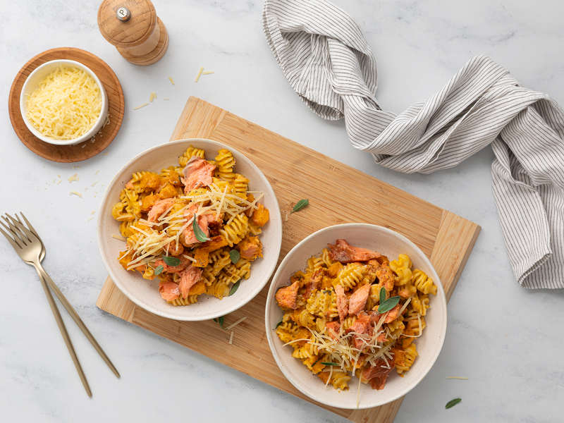 Creamy smoked salmon pasta topped with pecorino and sage