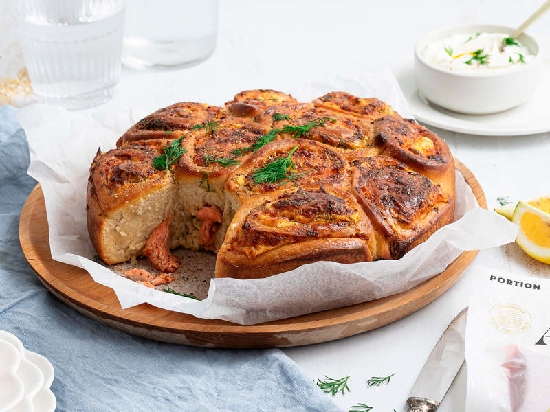 Cheesy smoked salmon pinwheels served warm for sharing