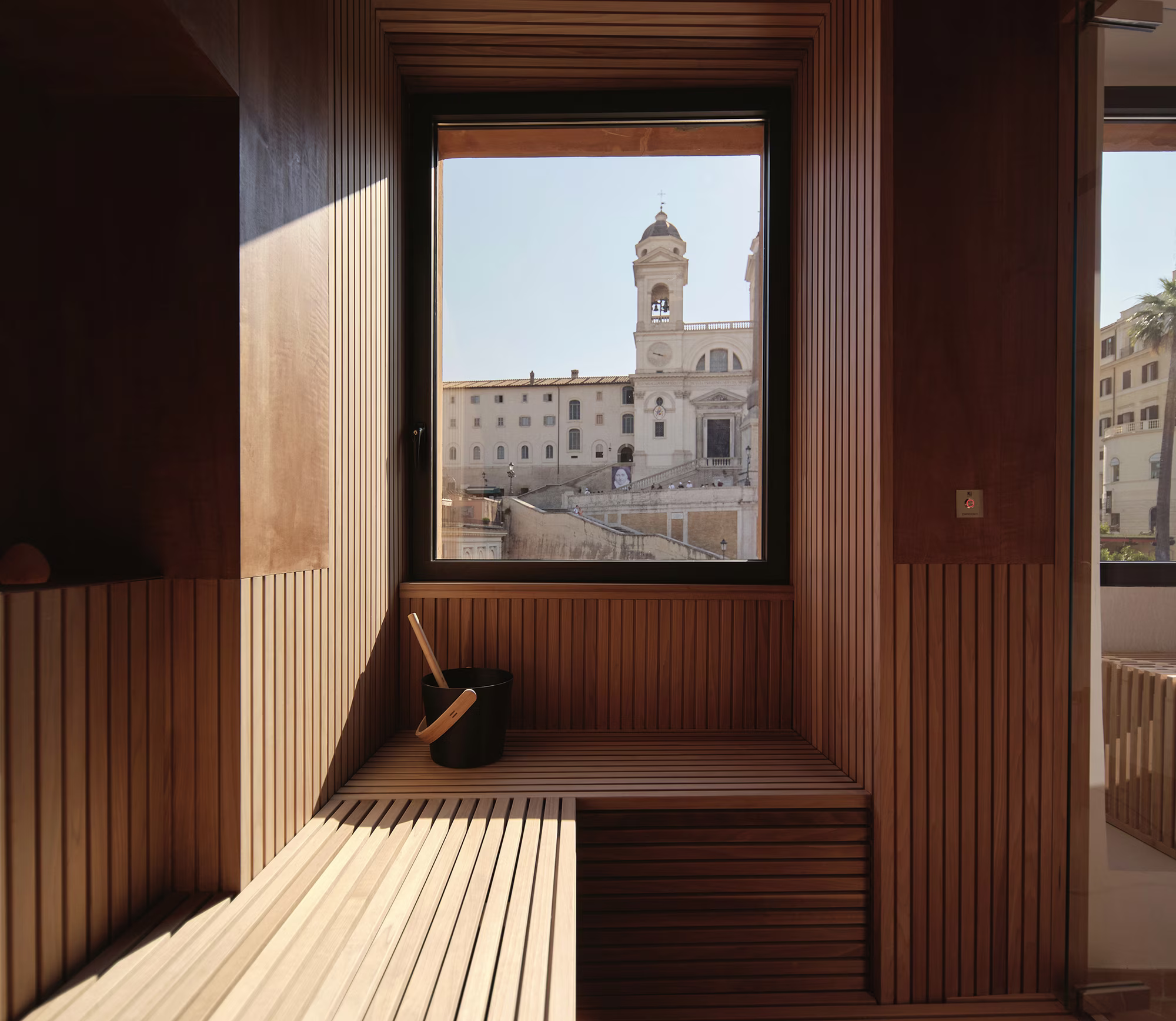 Wood-panelled spa sauna with a window over the Spanish Steps